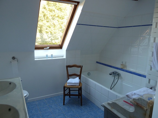 Private ensuite bathroom with a bath.